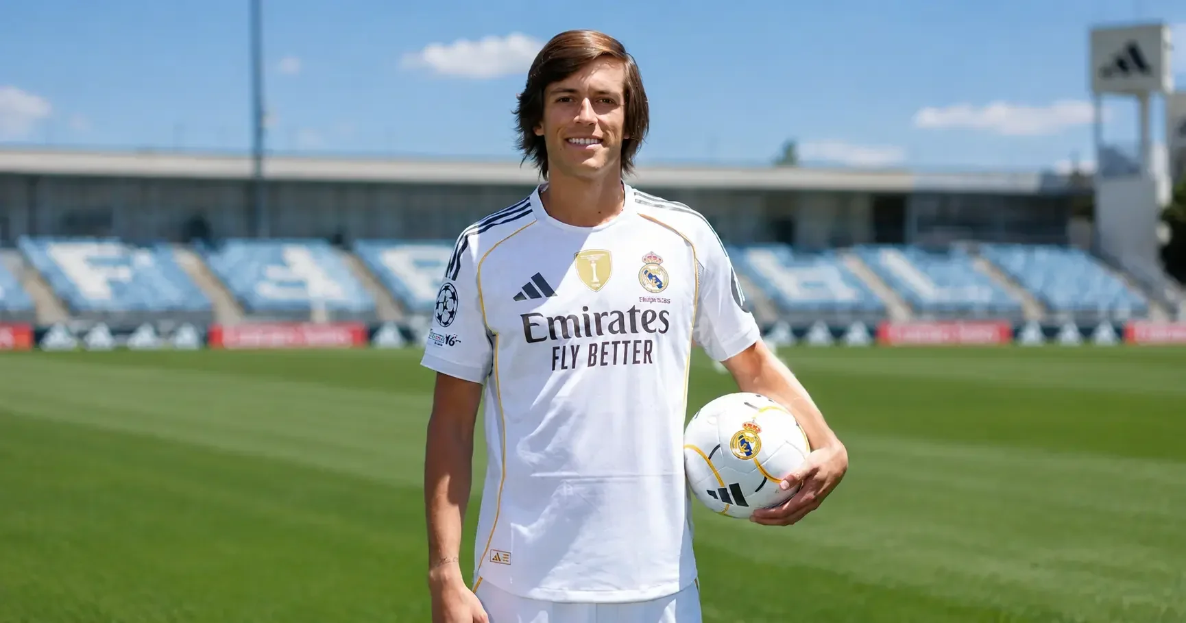 Alvaro Carreras holding a ball in a Real Madrid shirt