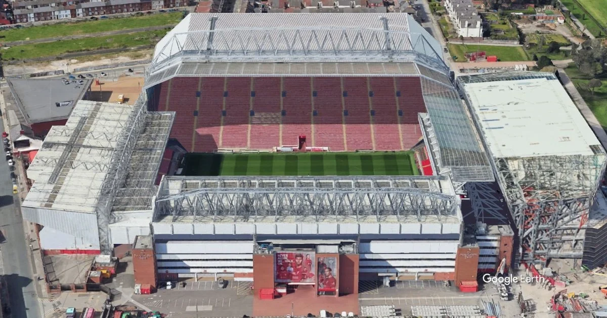 Anfield stadium in Liverpool with home crowd and iconic stands
