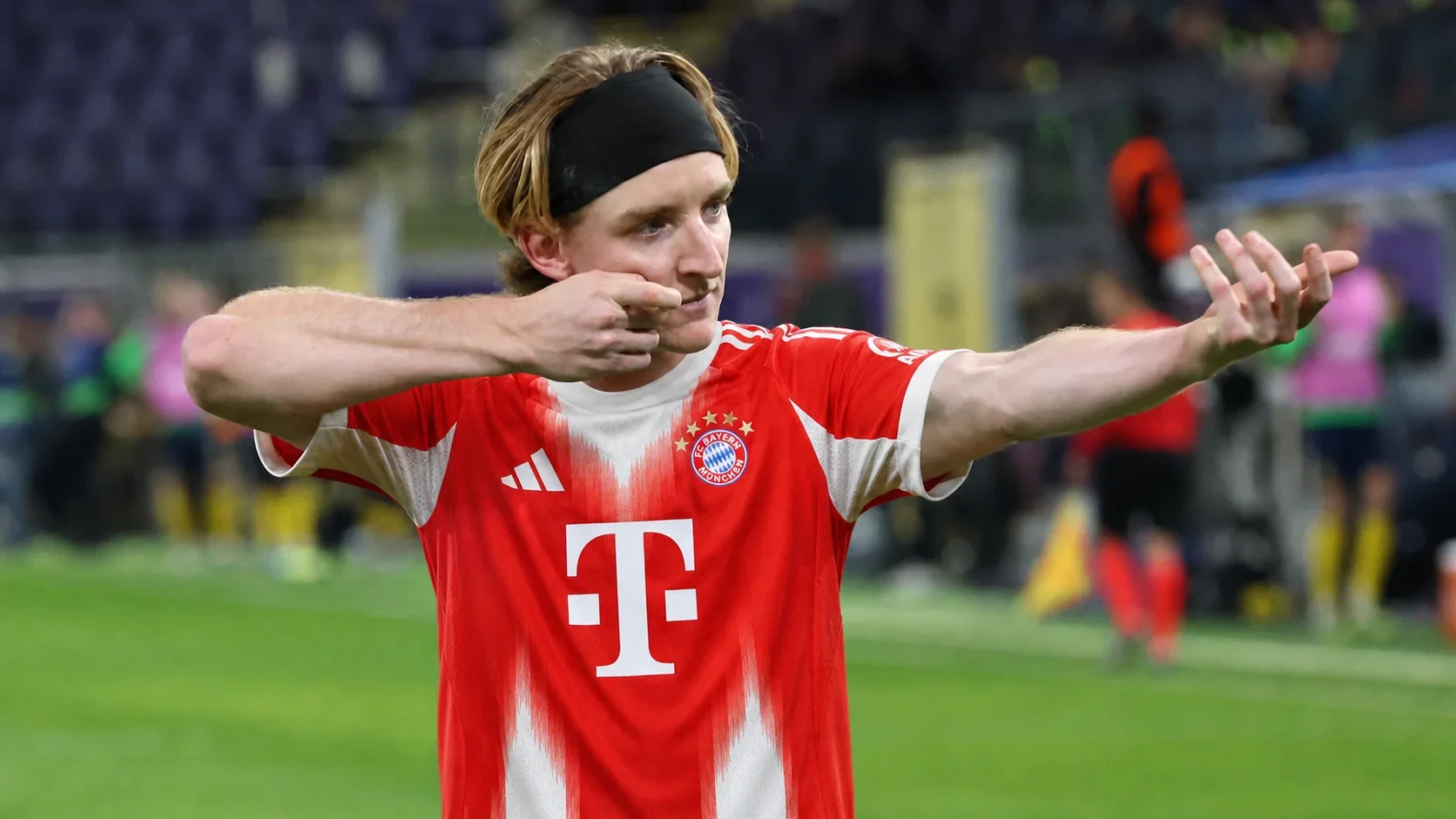 Alt text: Anthony Gordon wearing a Bayern Munich shirt during a football celebration