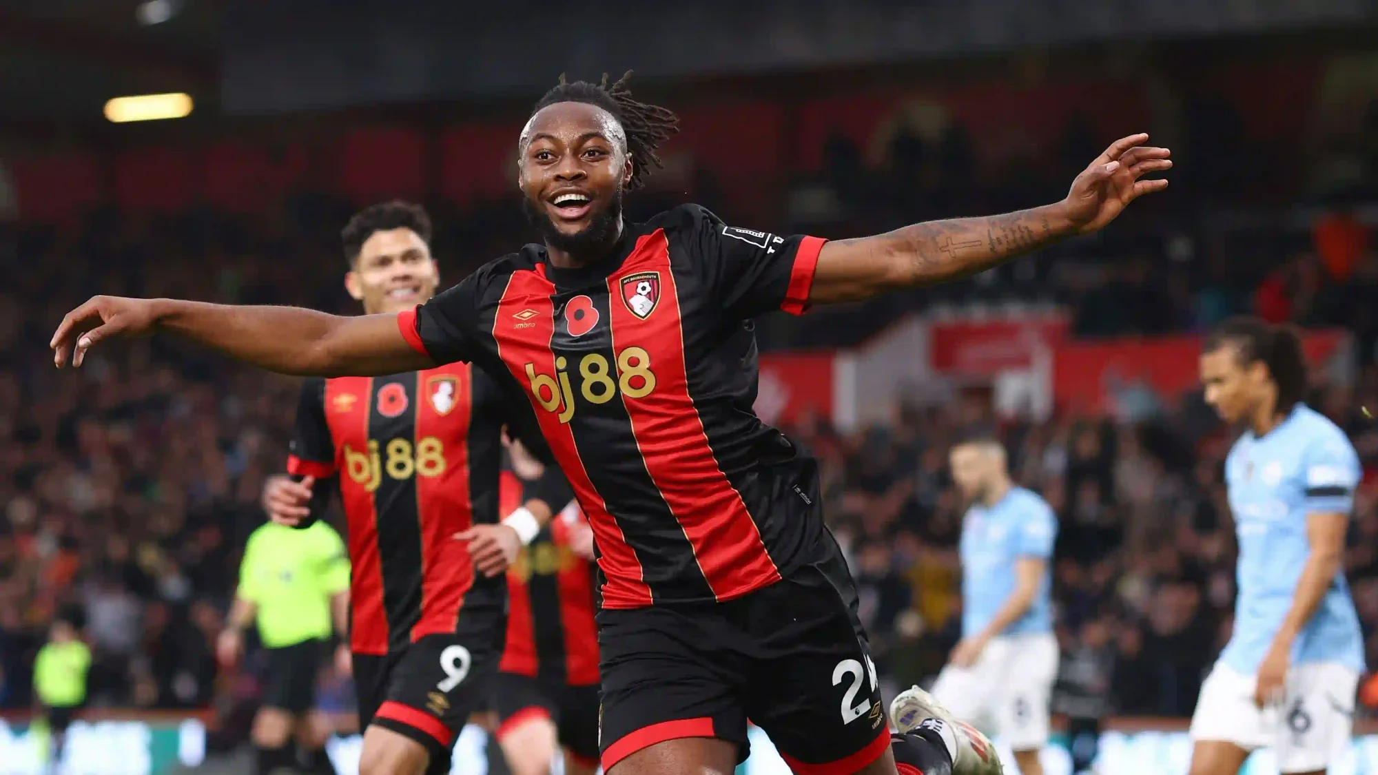Bournemouth forward Antoine Semenyo celebrates a goal in the black-and-red home kit.