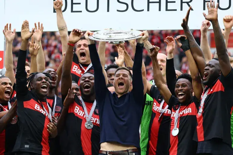 bayer leverkusen lifting the bundesliga trophy