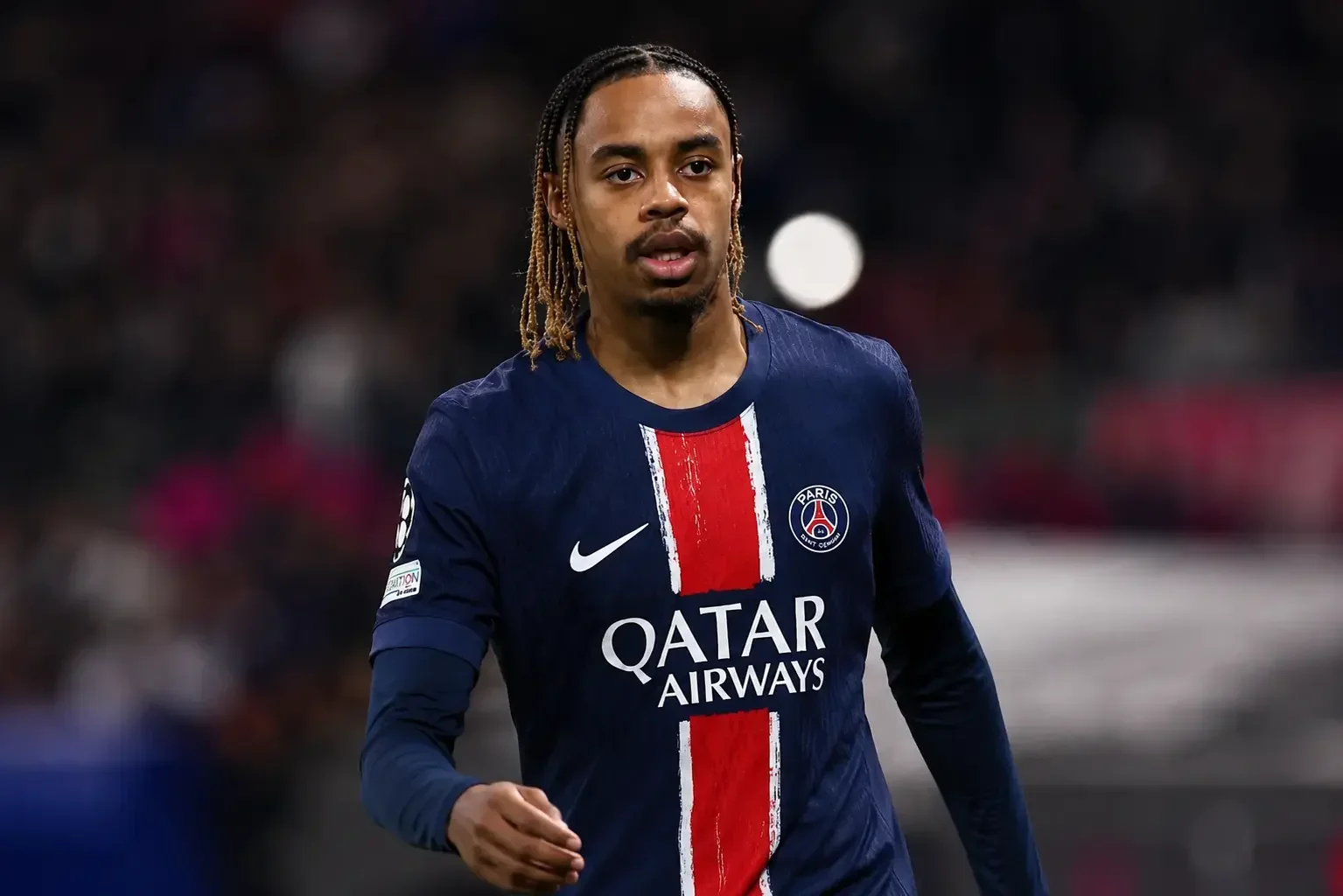 Bradley Barcola in action for PSG in navy home kit