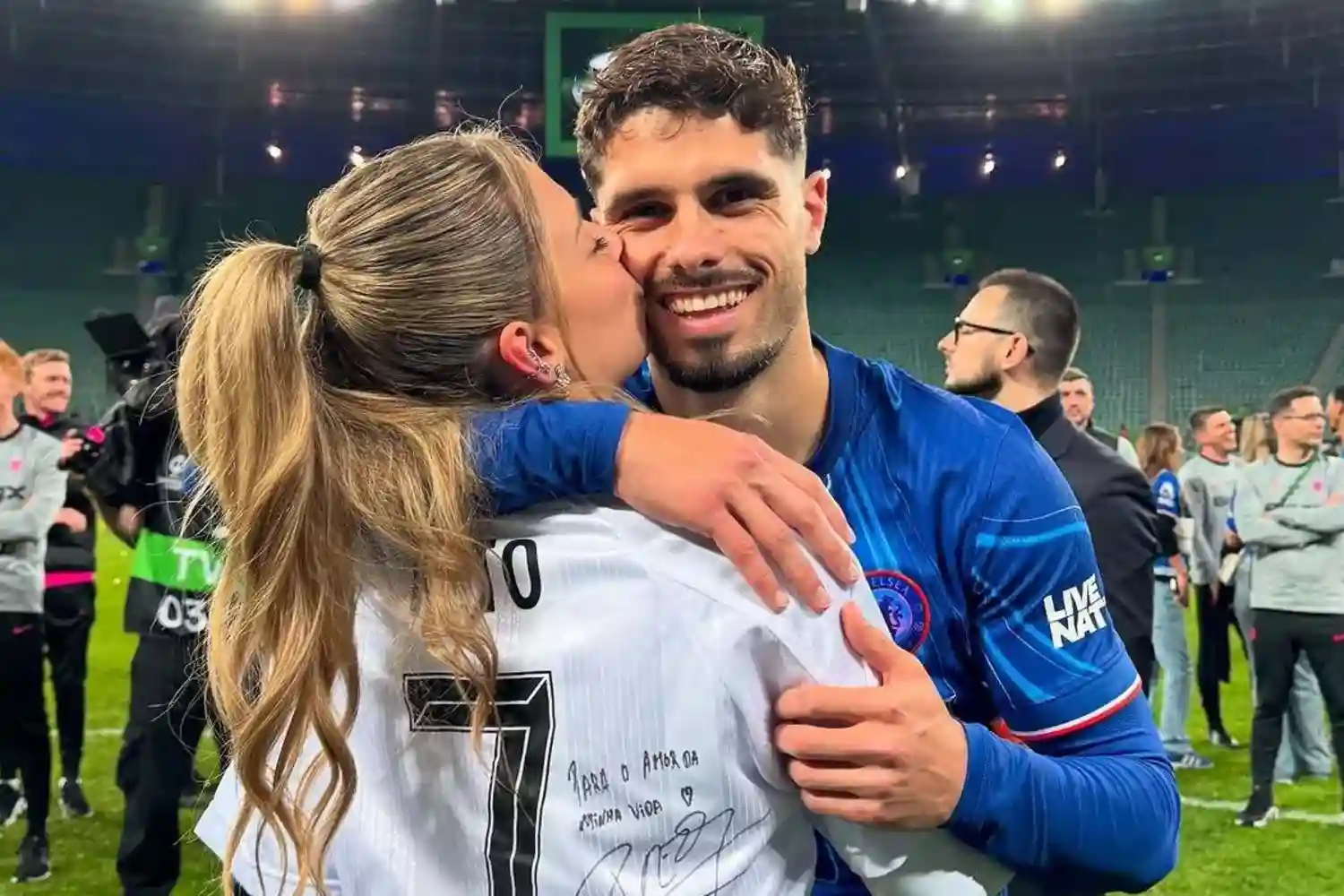 pedro neto and carolina silva hugging after chelsea won conference league