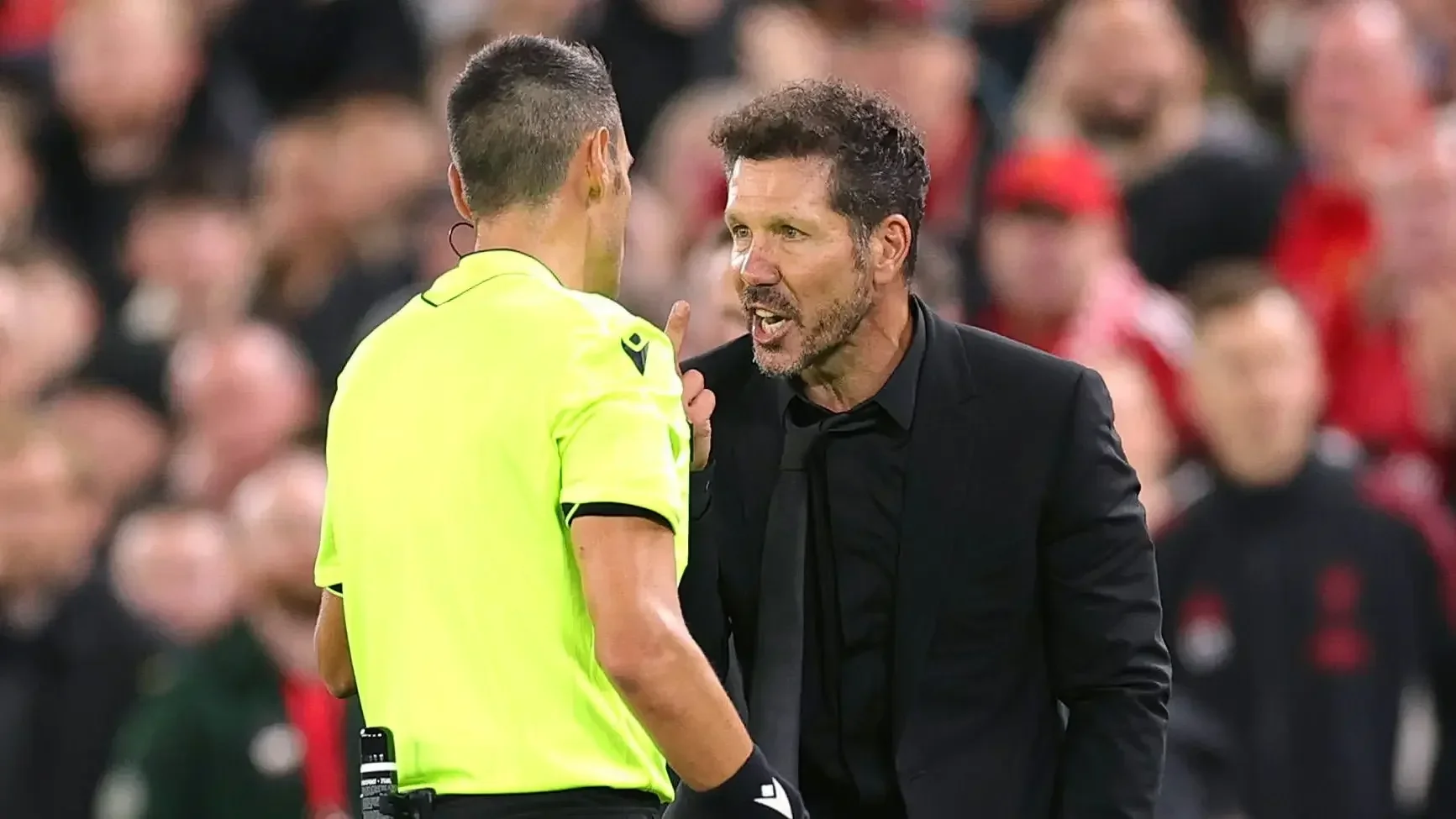 Diego Simeone argues with the referee on the touchline during an Atletico Madrid match