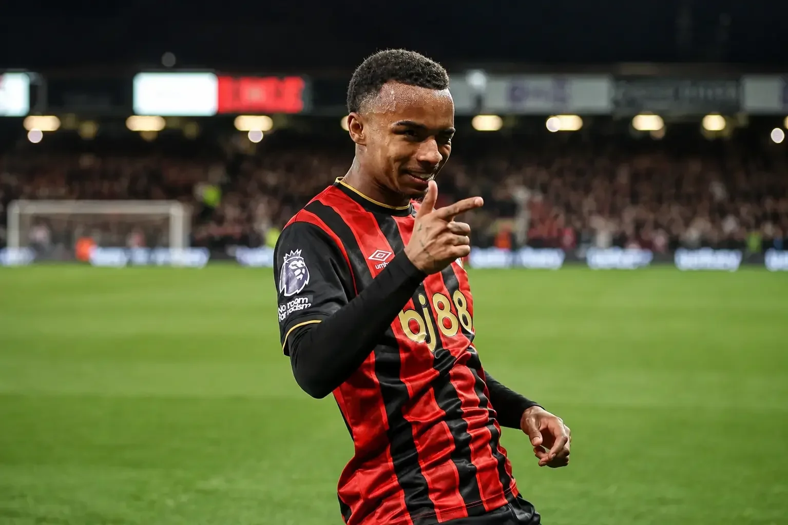 Eli Junior Kroupi celebrating in a Bournemouth shirt