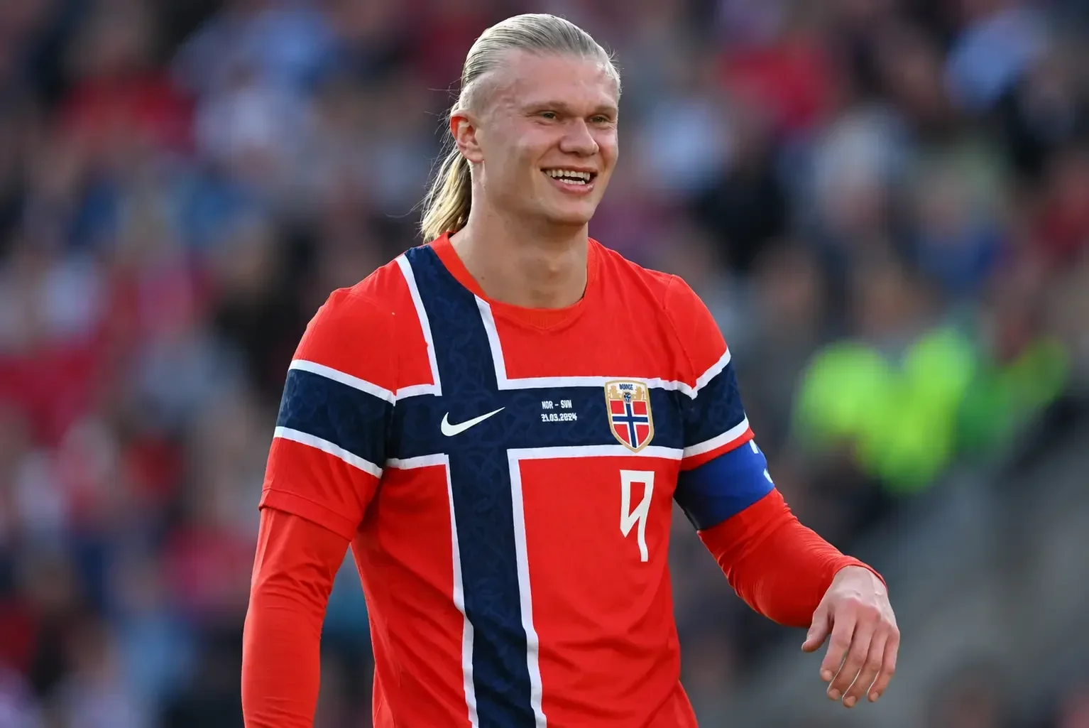 Erling Haaland smiling in a Norway shirt