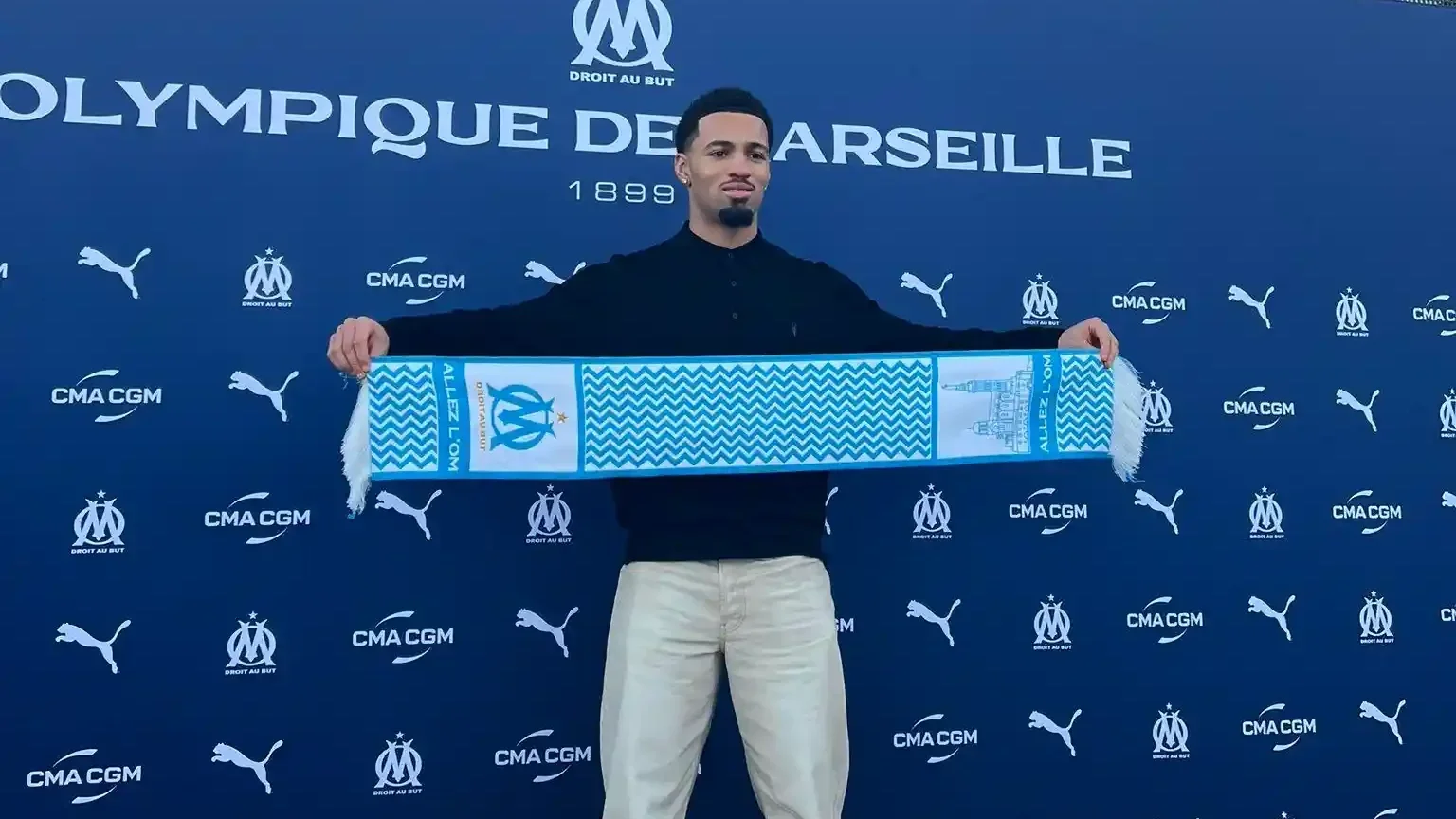 Olympique de Marseille Ethan Nwaneri holding a club scarf during official presentation