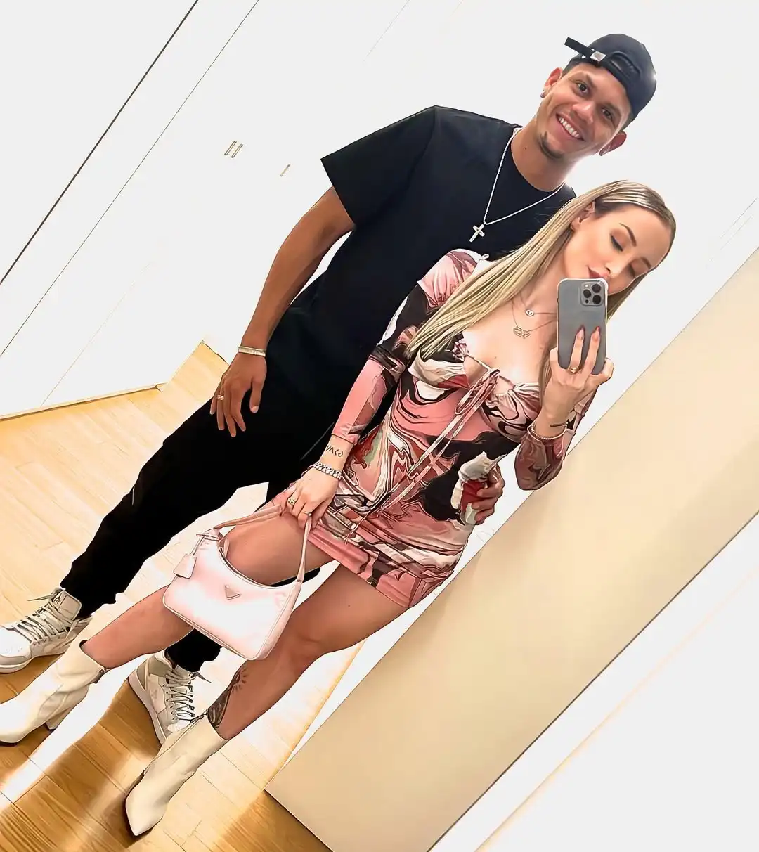 evanislon and his wife mariana posing for a selfie in front of mirror