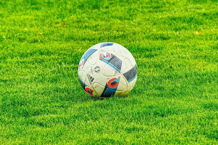 Football on green grass field