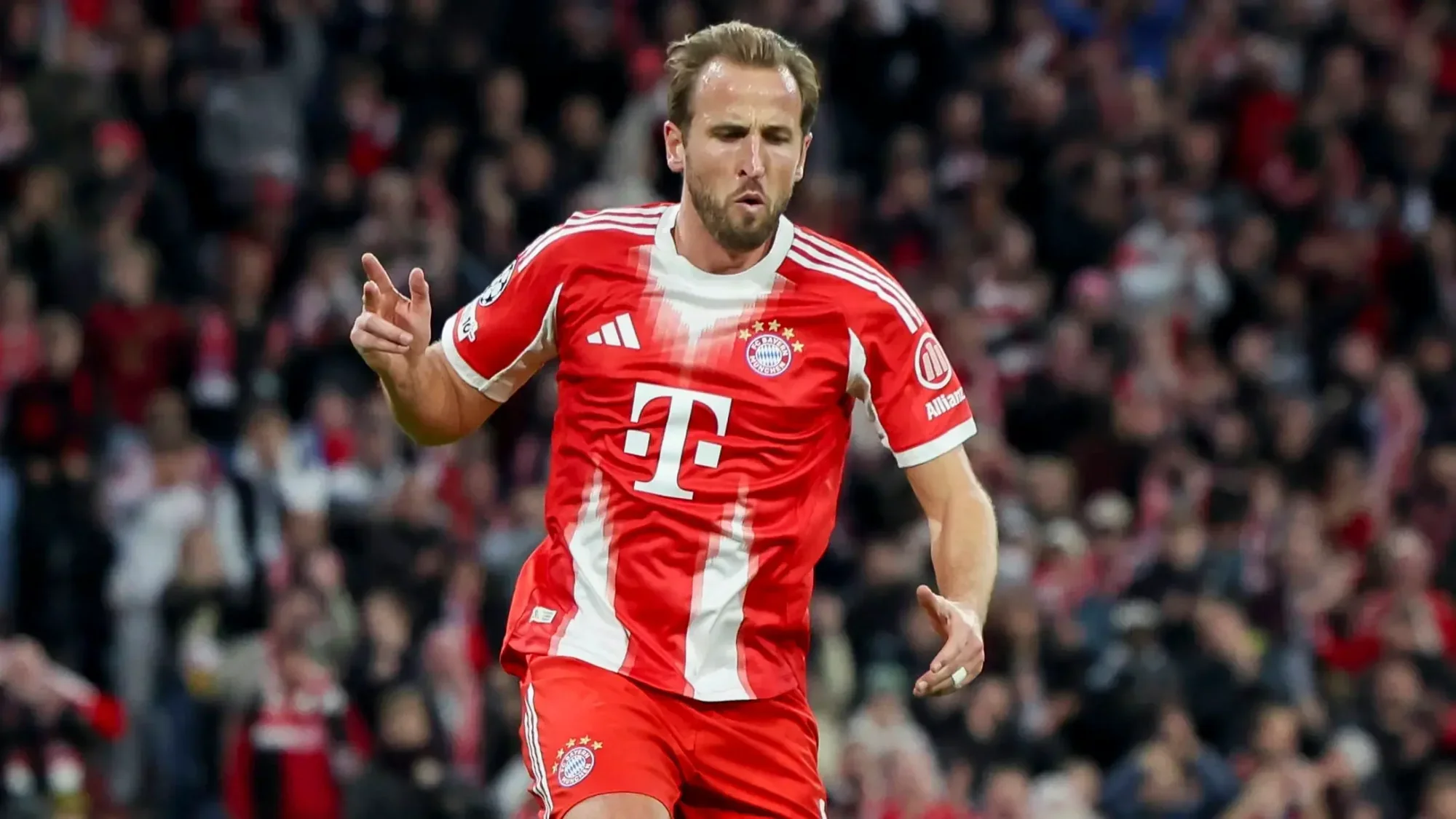 Harry Kane in action for Bayern Munich in the red home kit during a match
