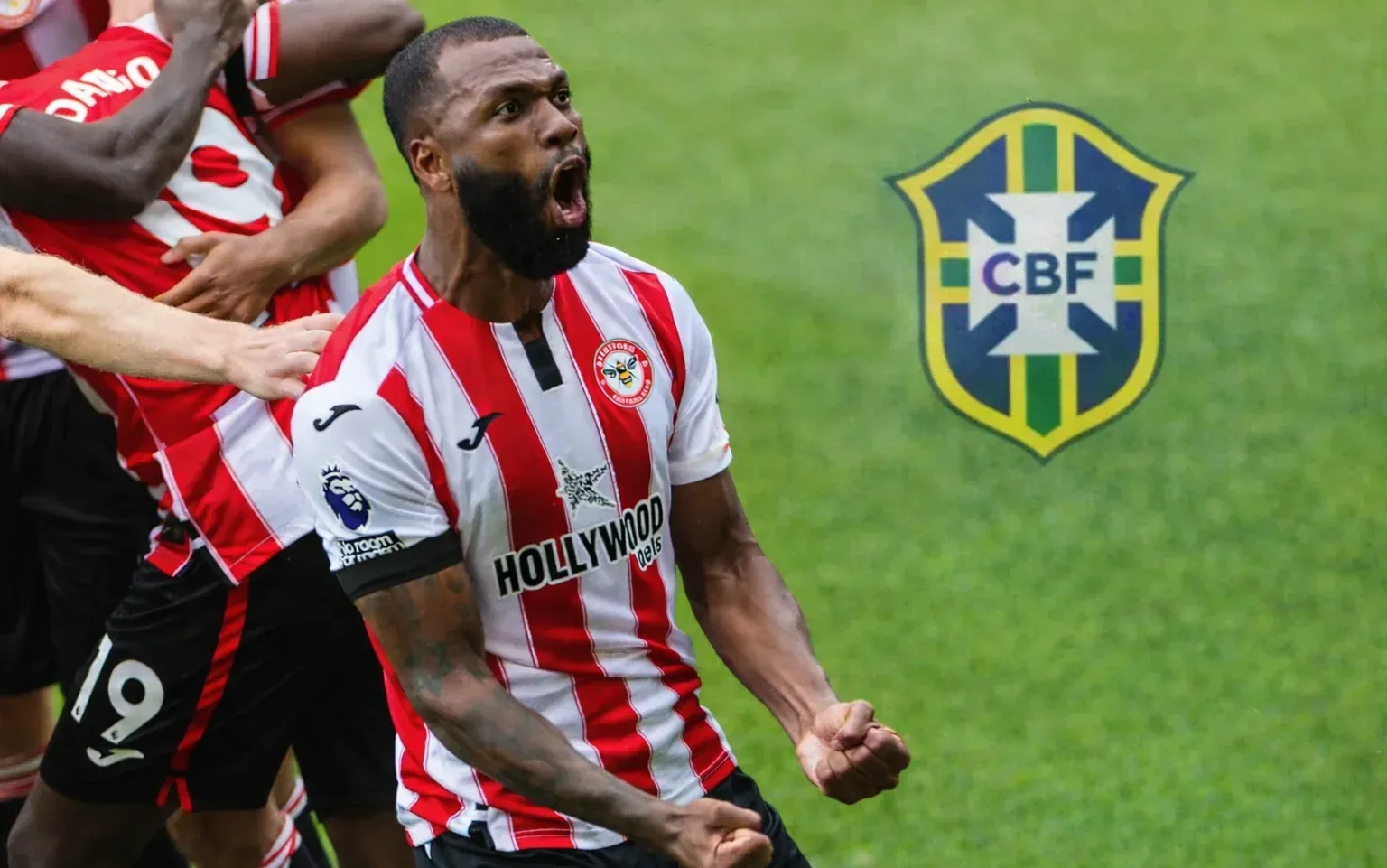Igor Thiago celebrating for Brentford, fists clenched, with a softly blended Brazil CBF badge in the empty green space on the right.