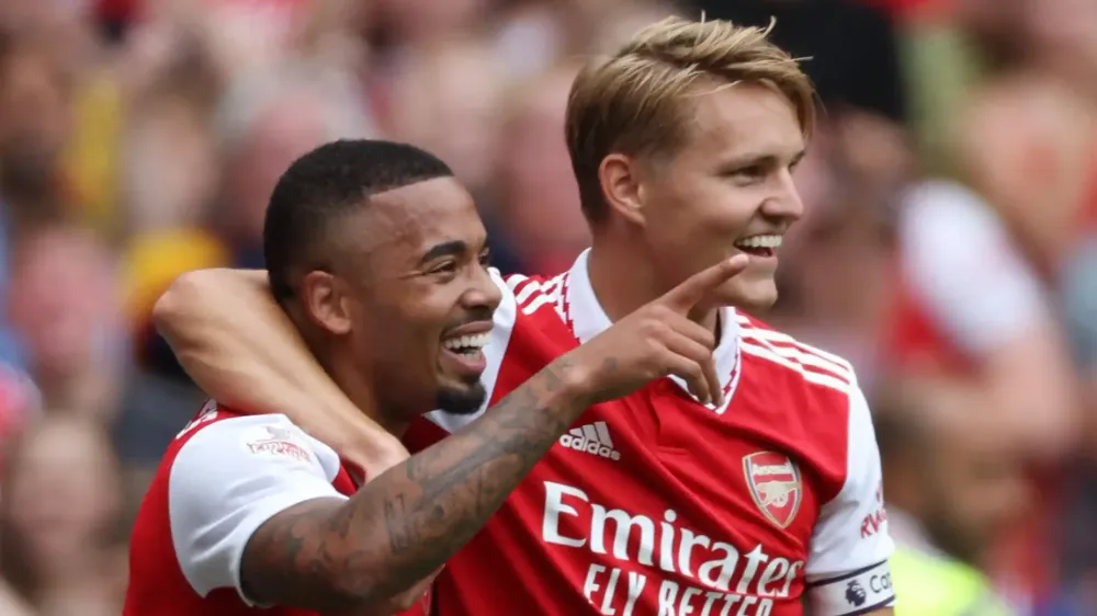 gabriel jesus and martin odegaard hugging after jesus scored a goal