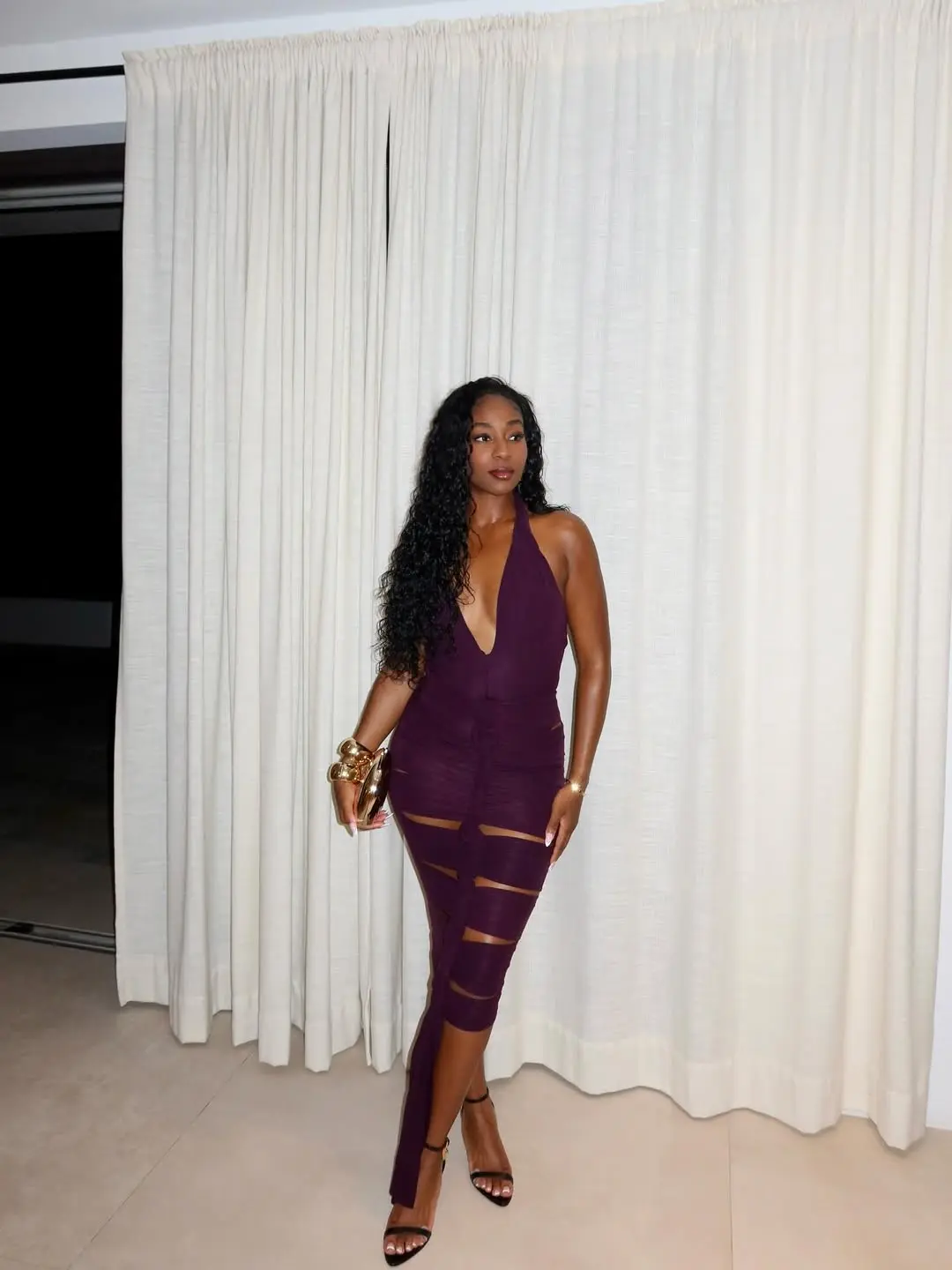 jordeen buckley wearing tight purple dress