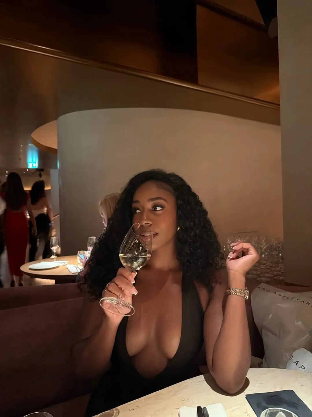 jordeen buckley drinking wine at dinner