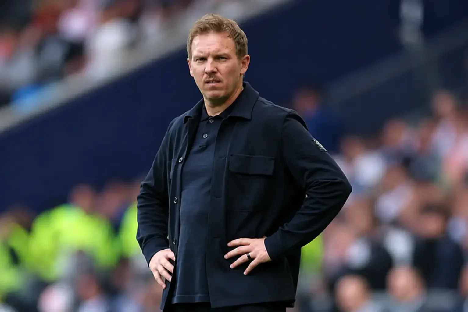 Julian Nagelsmann standing on the touchline during a football match.