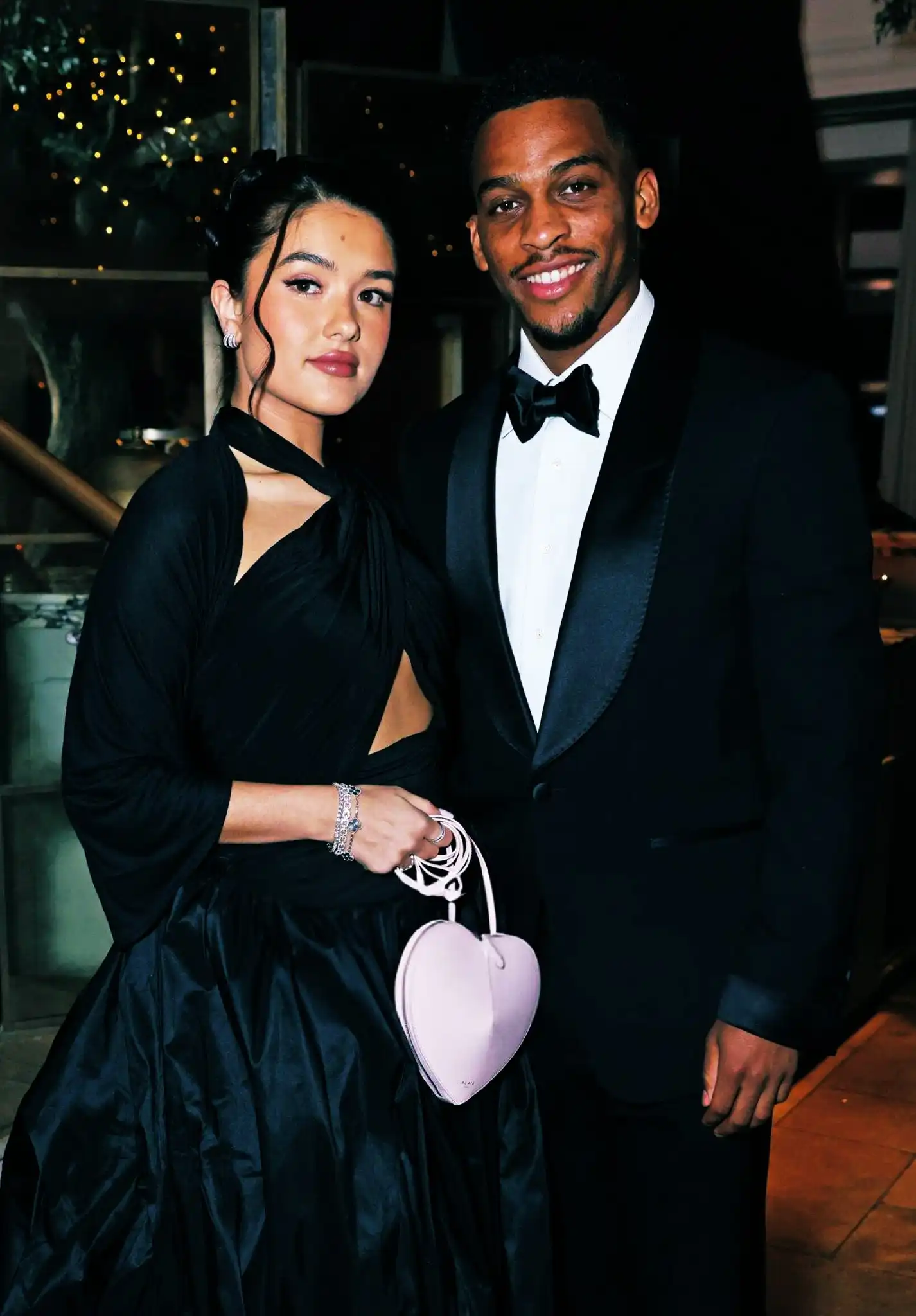 jurrien timber and his girlfriend rose de back wearing official clothing