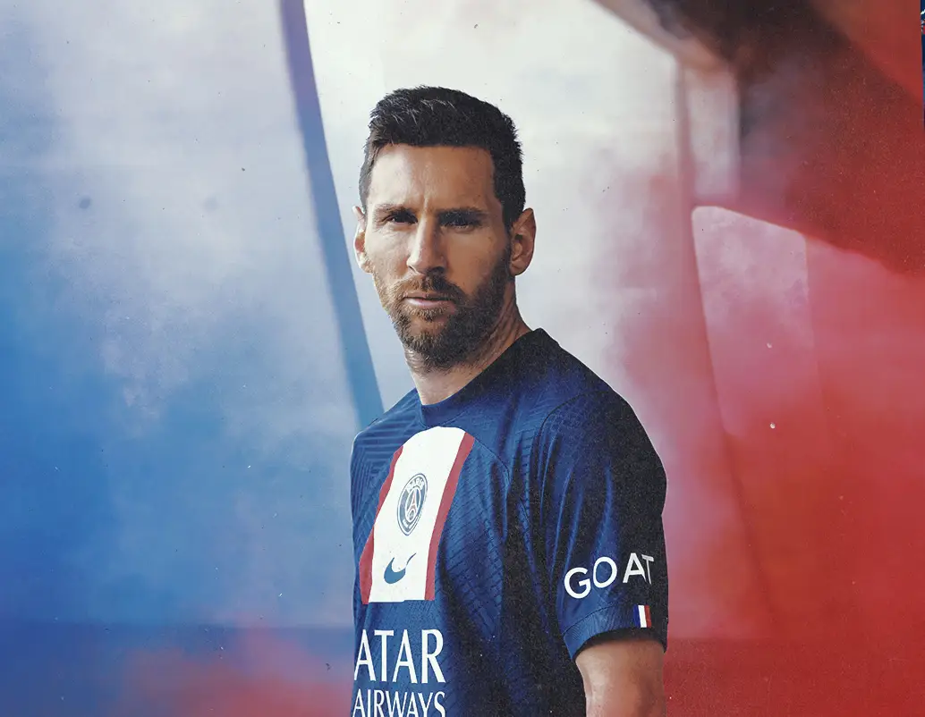 Lionel Messi wearing PSG home kit for 2022/23 and looking serious at the camera