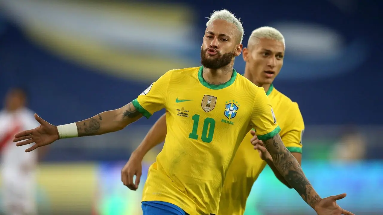 neymar jr celebrating with richarlison after scoring a goal for brazil national team