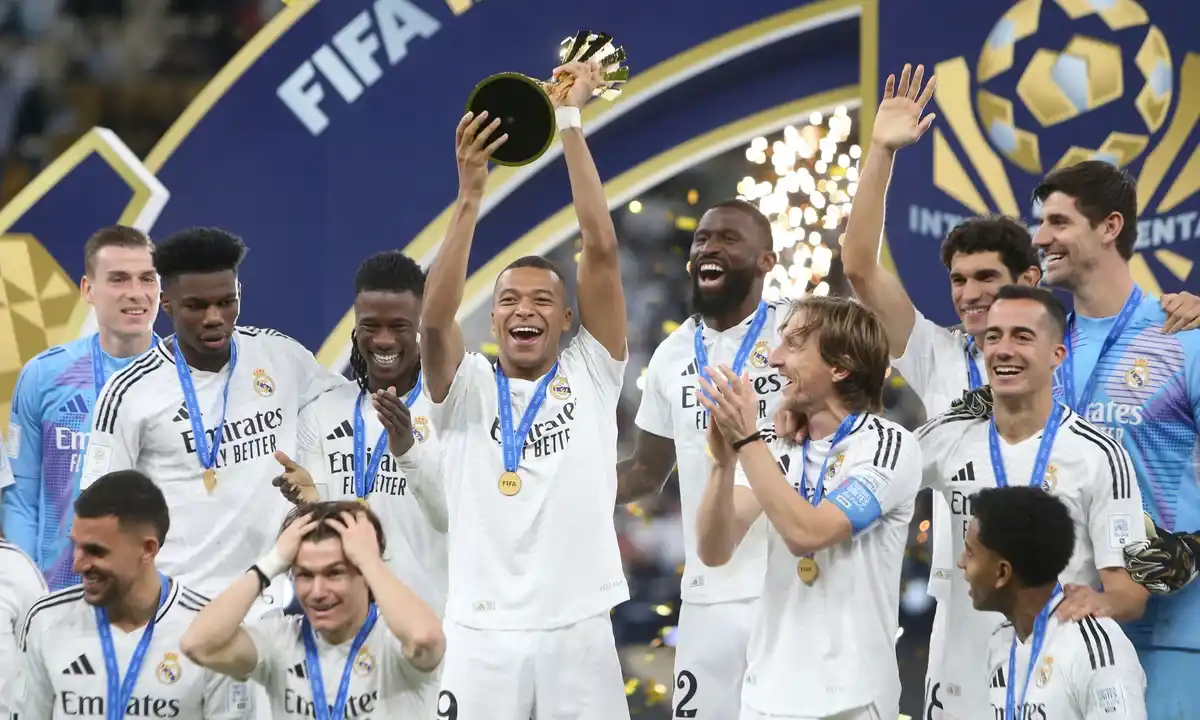 mbappe lifting a trophy with real madrid