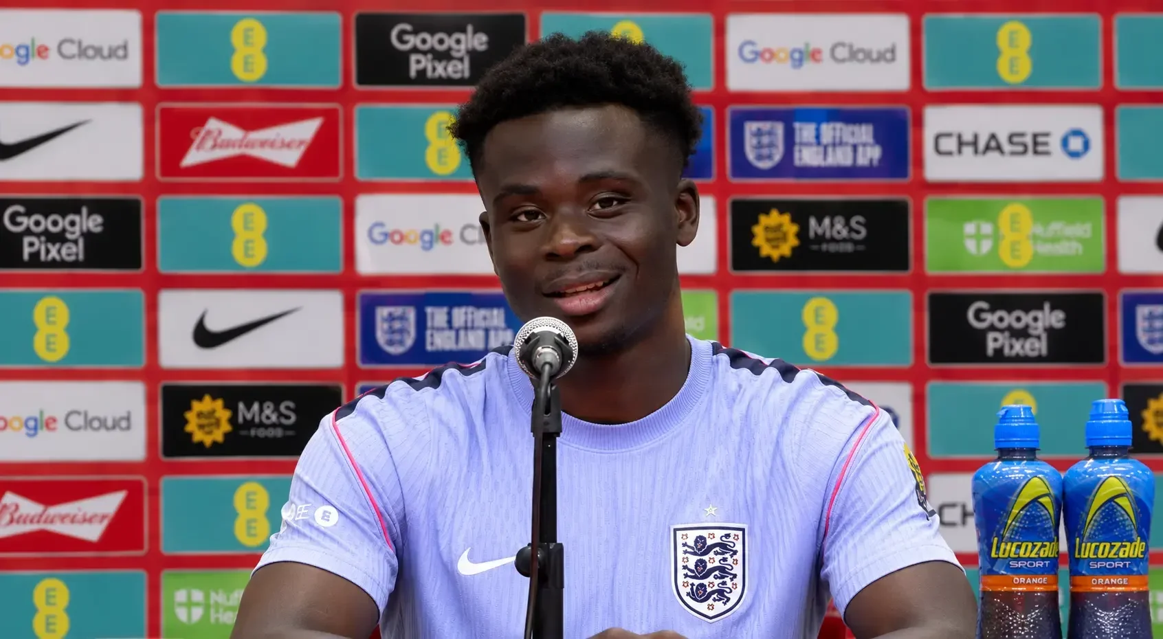 Bukayo Saka speaking at a press conference