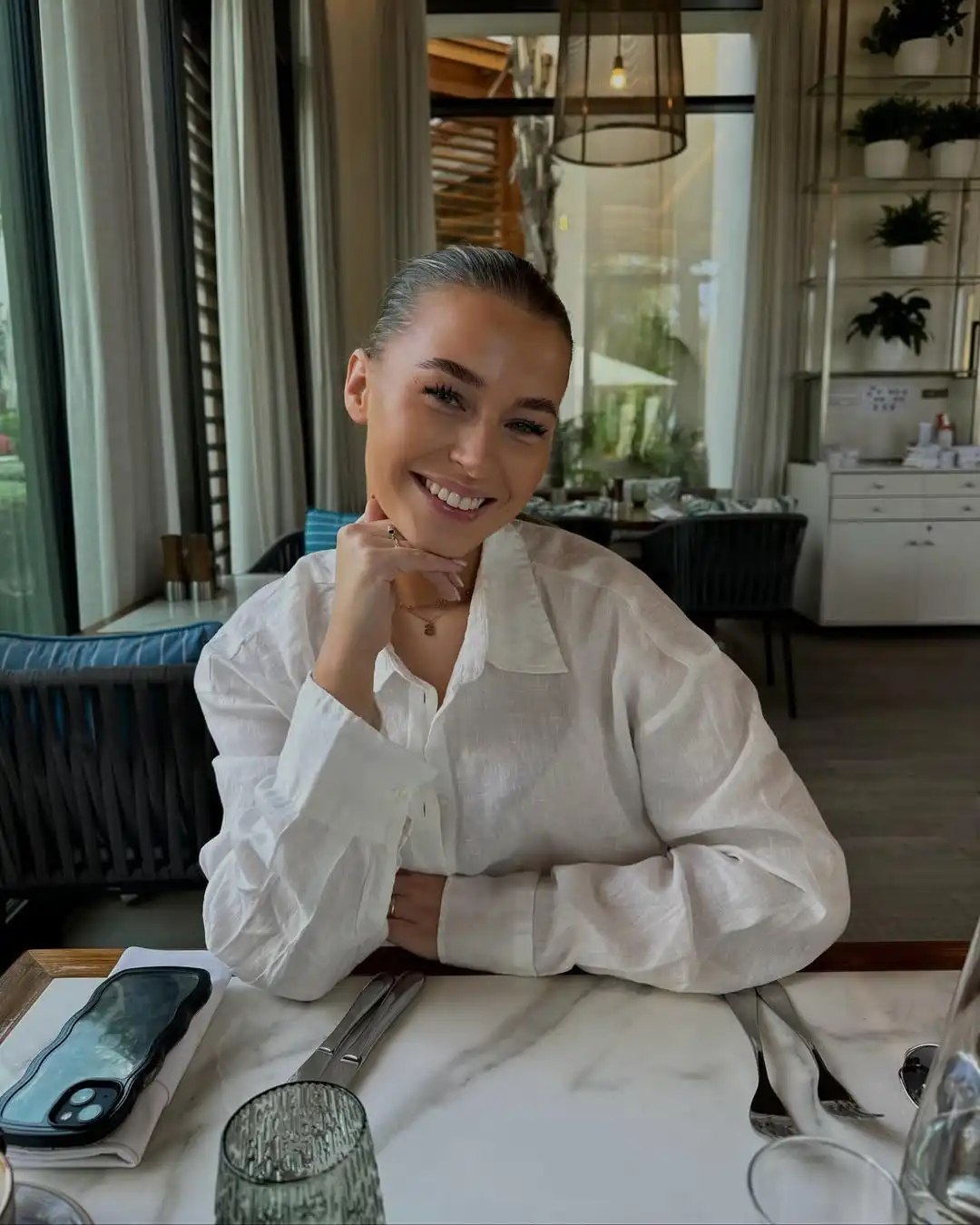 sterre van bakel smiling for the camera at a restaurant