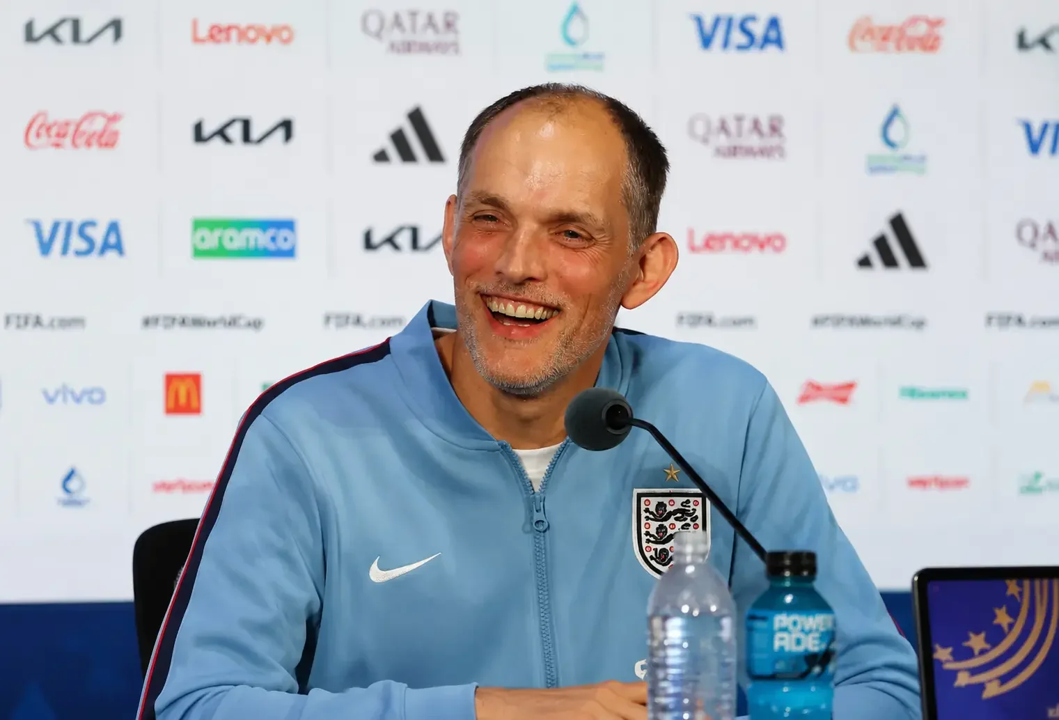 Thomas Tuchel smiling at an England press conference